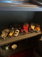 2 shelves of knickknacks and collector cars