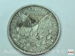 Coins - 1899o Silver Dollar, Morgan plus an empty Morgan Dollar storage binder for years 1892-1921