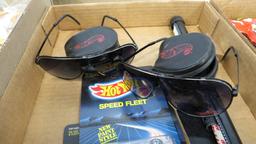 FLAT WITH HOT WHEELS, SUNGLASSES AND WINDOW SHADE