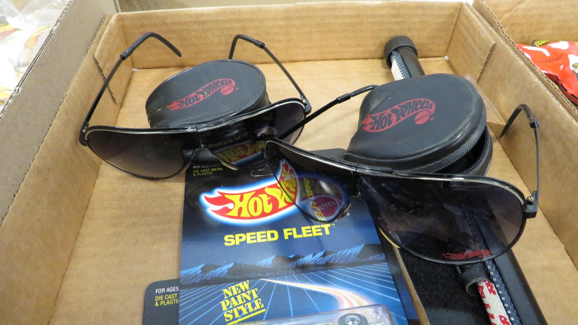 FLAT WITH HOT WHEELS, SUNGLASSES AND WINDOW SHADE