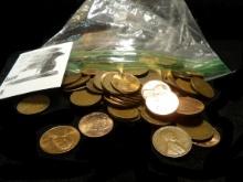Bag of what appears to be more than 100 Lincoln Cents. Many are Wheat back cents.