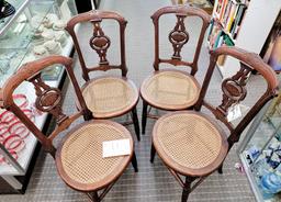Four wood chairs, cane seats