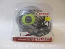 Riddell Mini Football Helmet NCAA Oregon Carbon Fiber Hydrofx, new in packaging, 8 oz