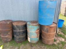 4-50 gallon metal barrels, 1 plastic