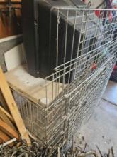 two dog cages and tv