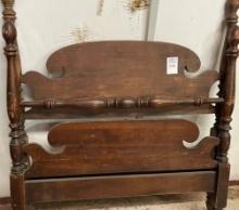 Antique single bed with wooden casters