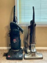 Two Upright Vacuums