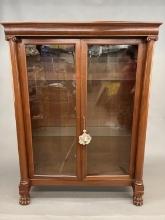 Neoclassical walnut display cabinet