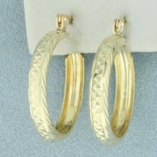 Diamond Cut Hoop Earrings In 14k Yellow Gold