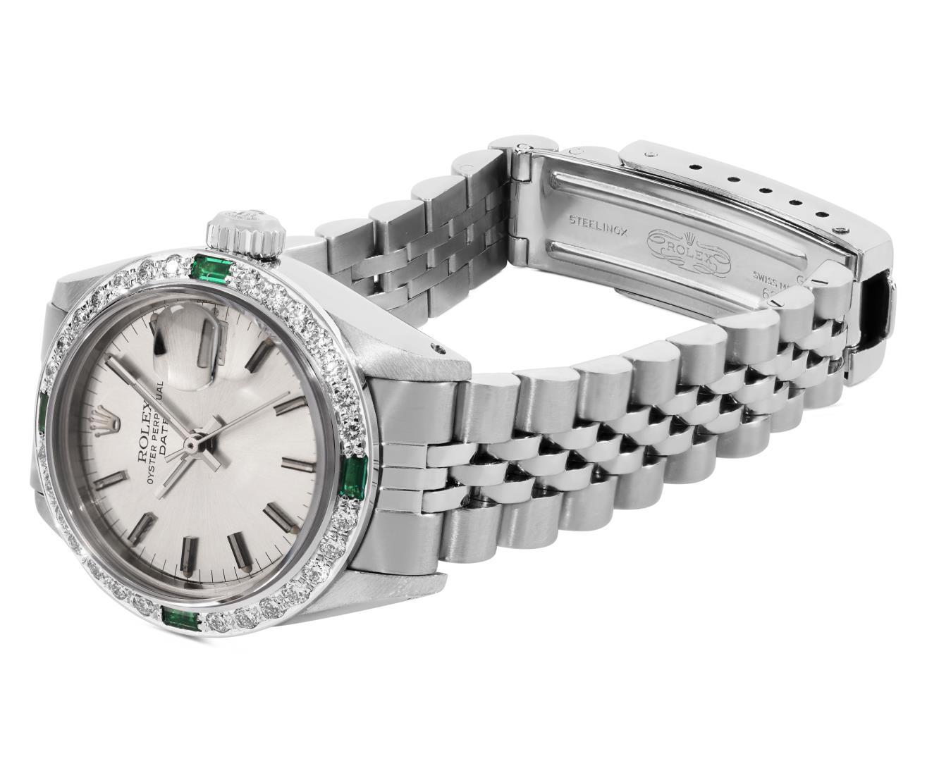 Rolex Ladies Stainless Steel Silver Index Emerald and Diamond Date Wristwatch