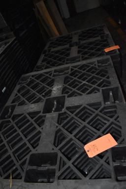 (4) STACKS OF NESTING PLASTIC PALLETS ON FLOOR,