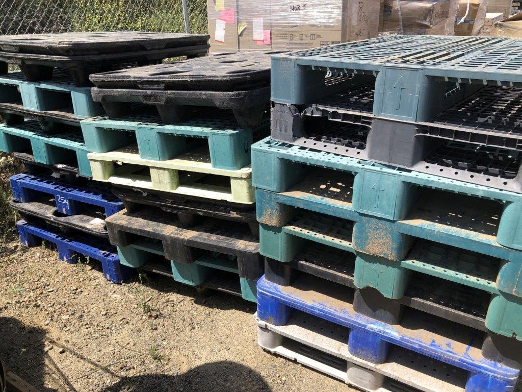 Stacks of Misc Plastic Pallets.