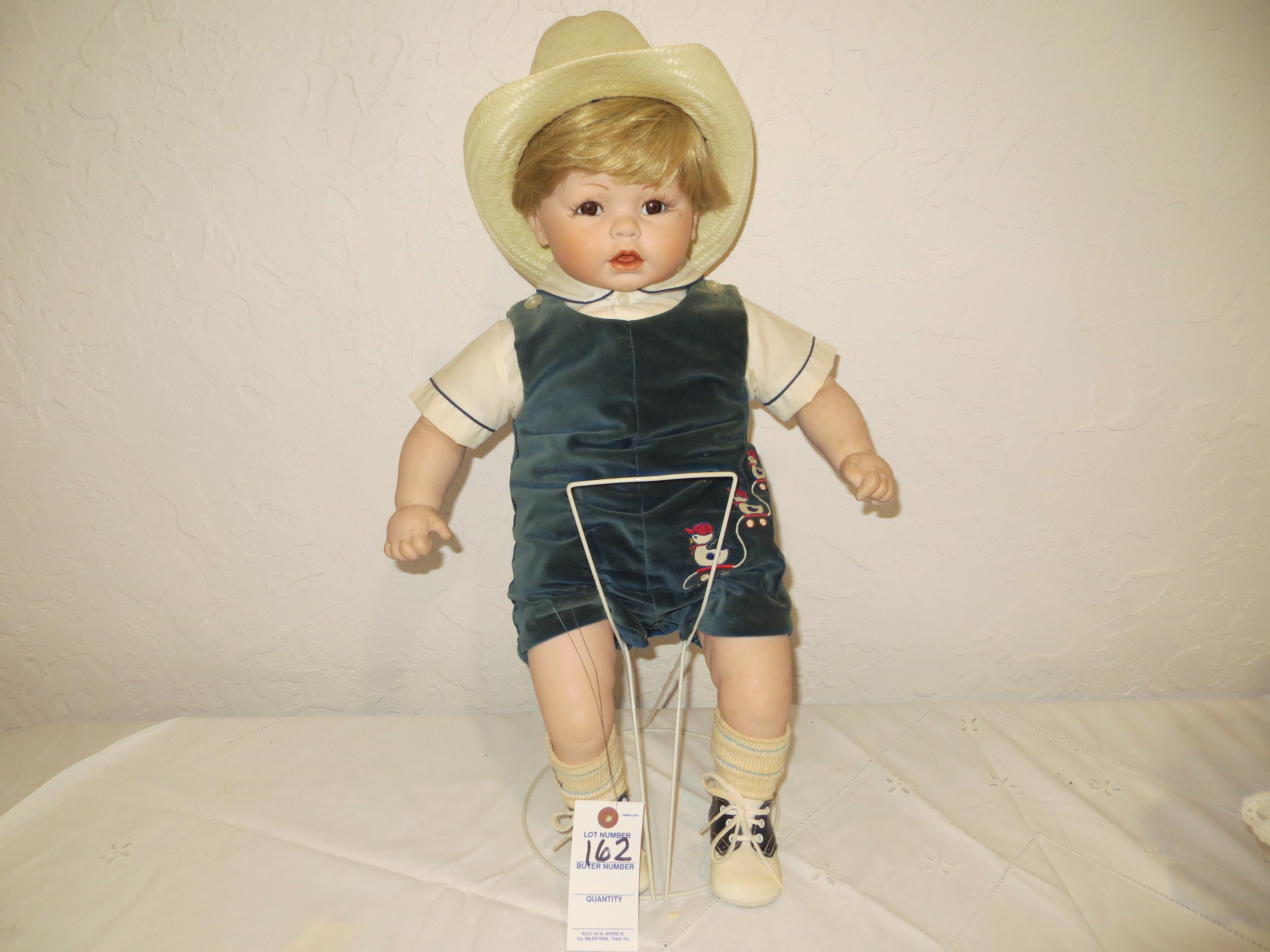 Sitting Boy Doll with ducks on clothes