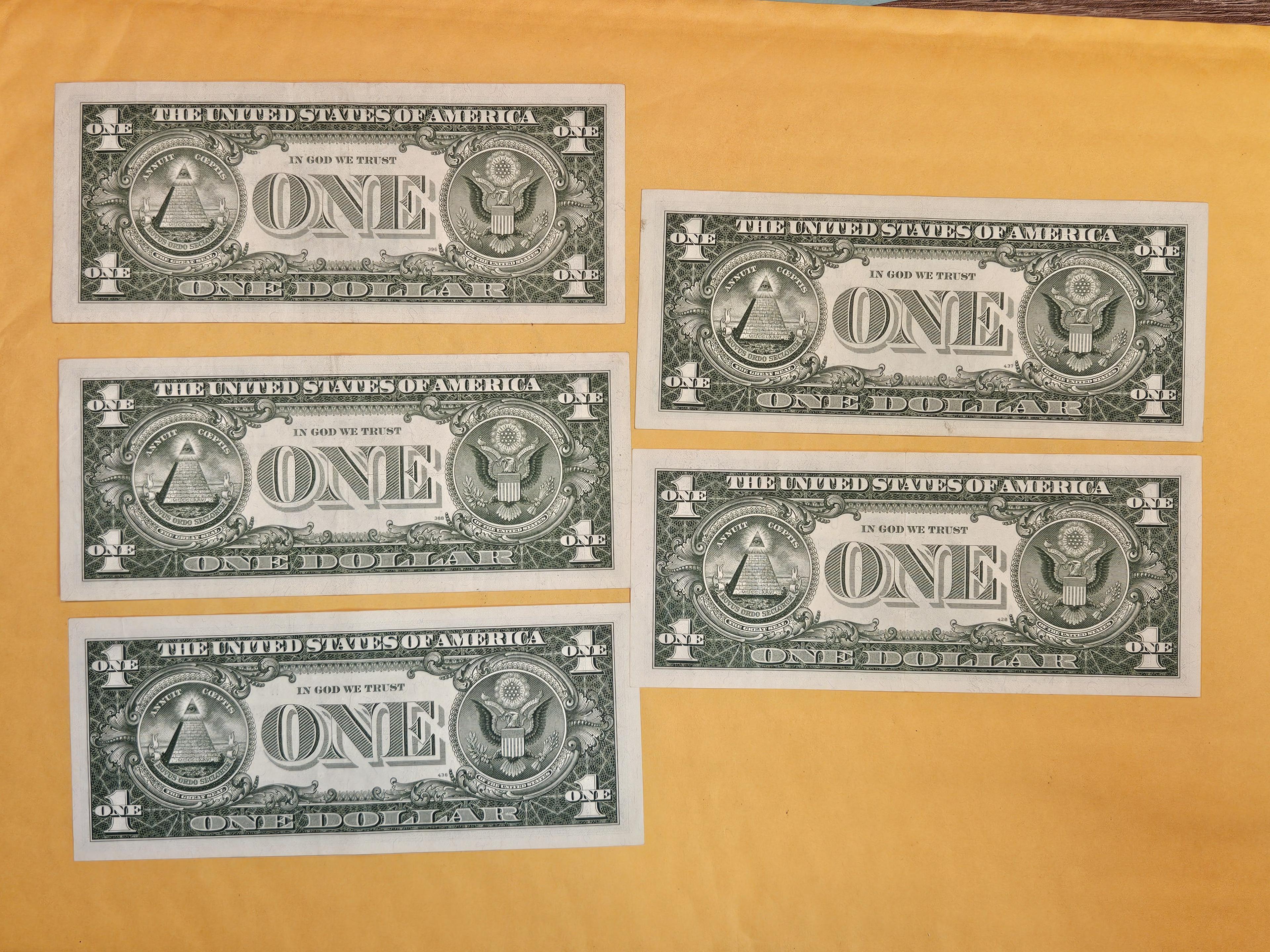 Five crisp One Dollar Silver Certificates