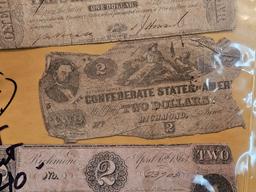 Four old pieces of Confederate currency