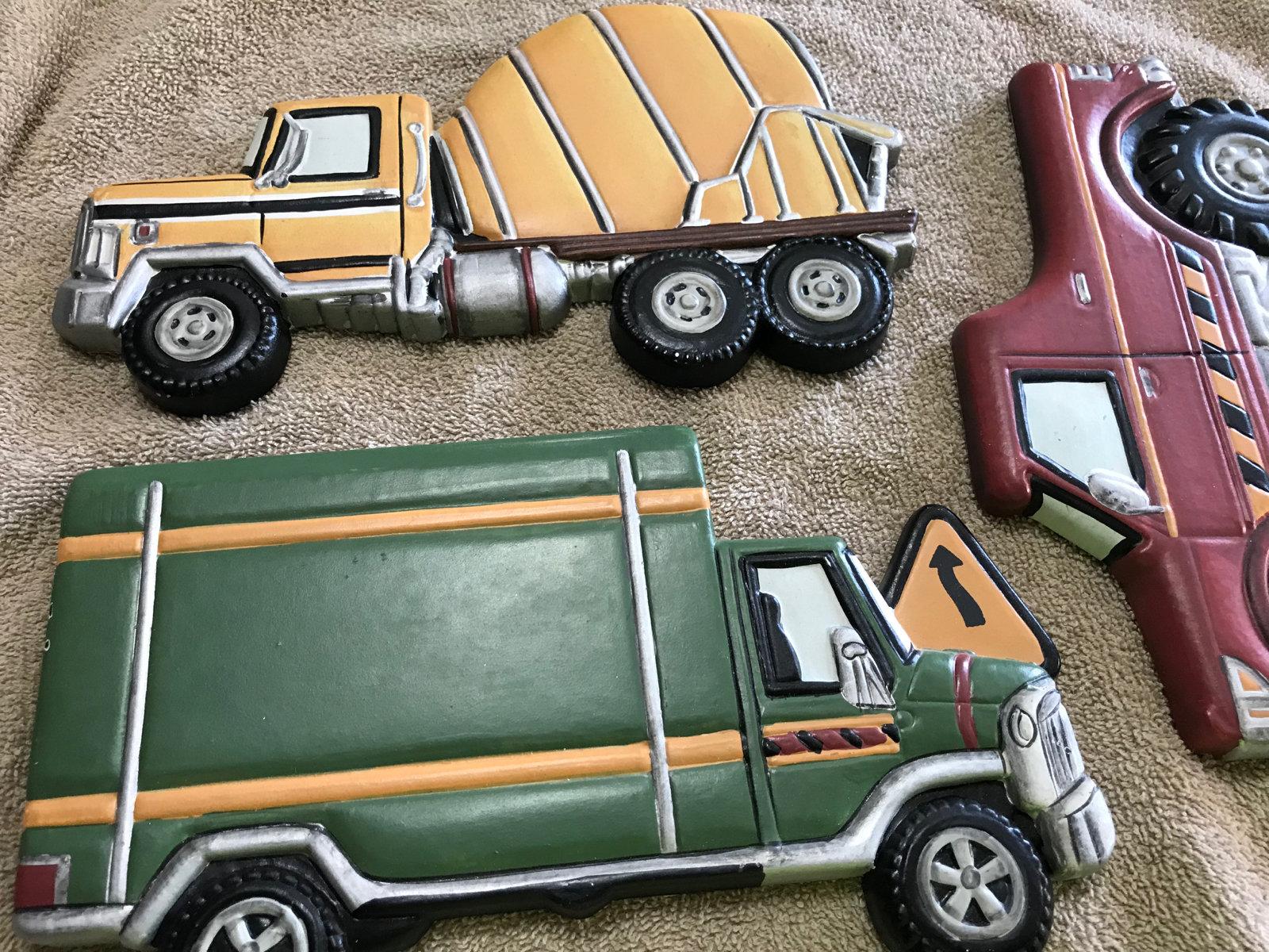 Wall hanging trucks, approx 8 inches long each