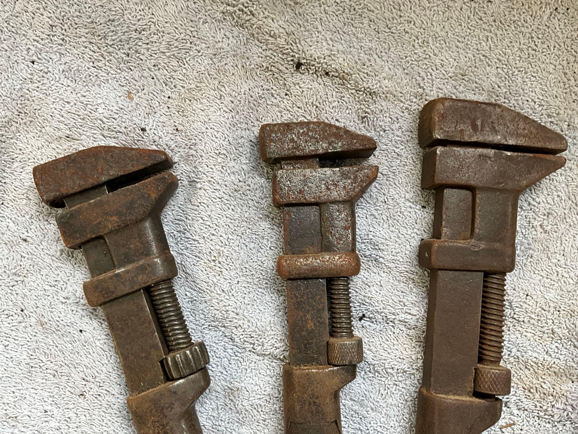 (4) antique adjustable wrenches