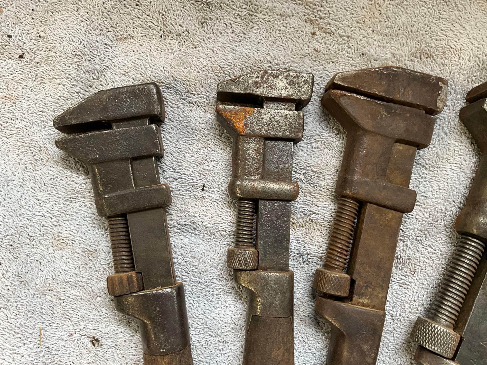 (4) antique adjustable wrenches