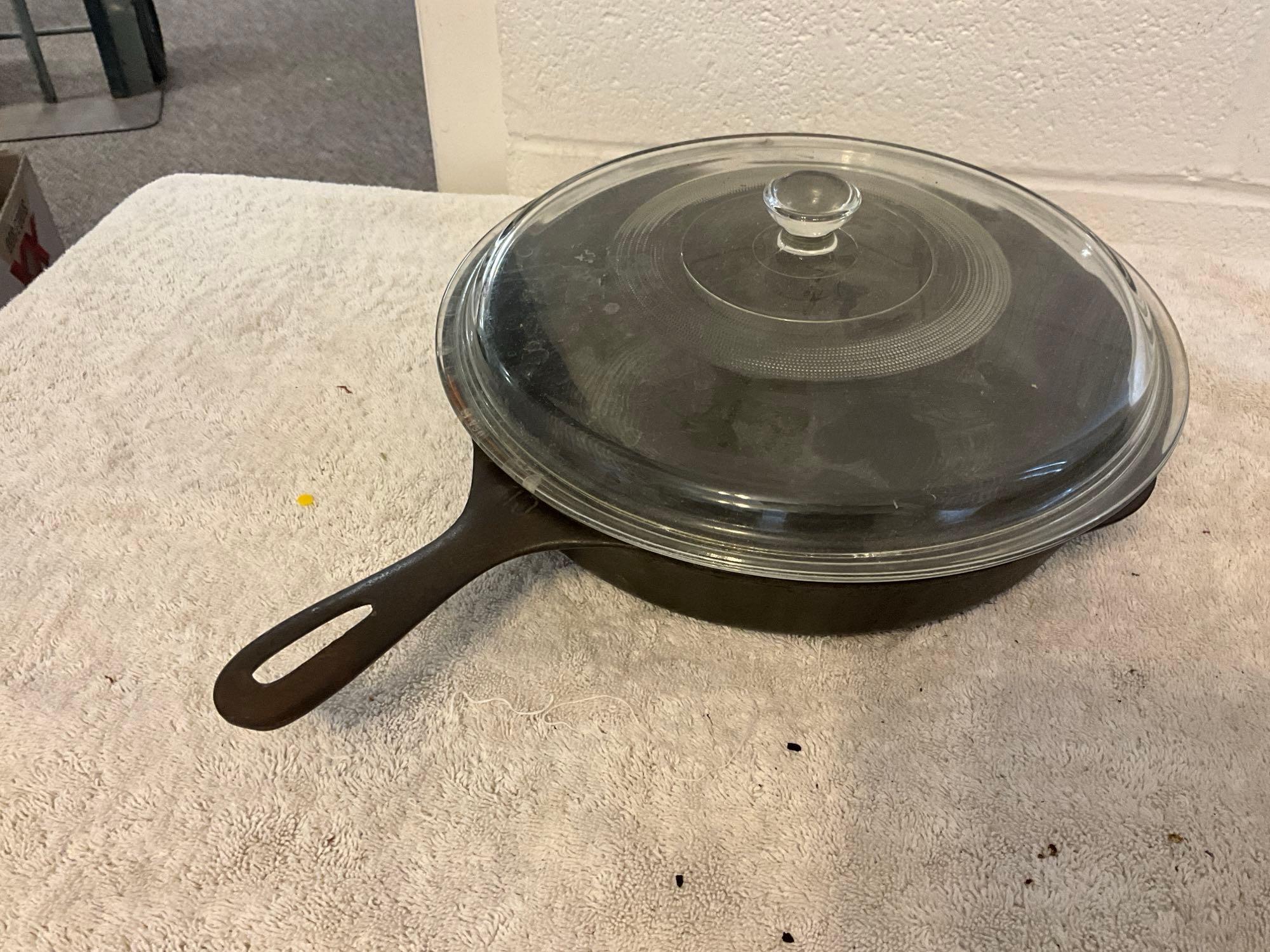 unmarked #10 cast iron skillet w/glass lid & unmarked #14 cast iron skillet