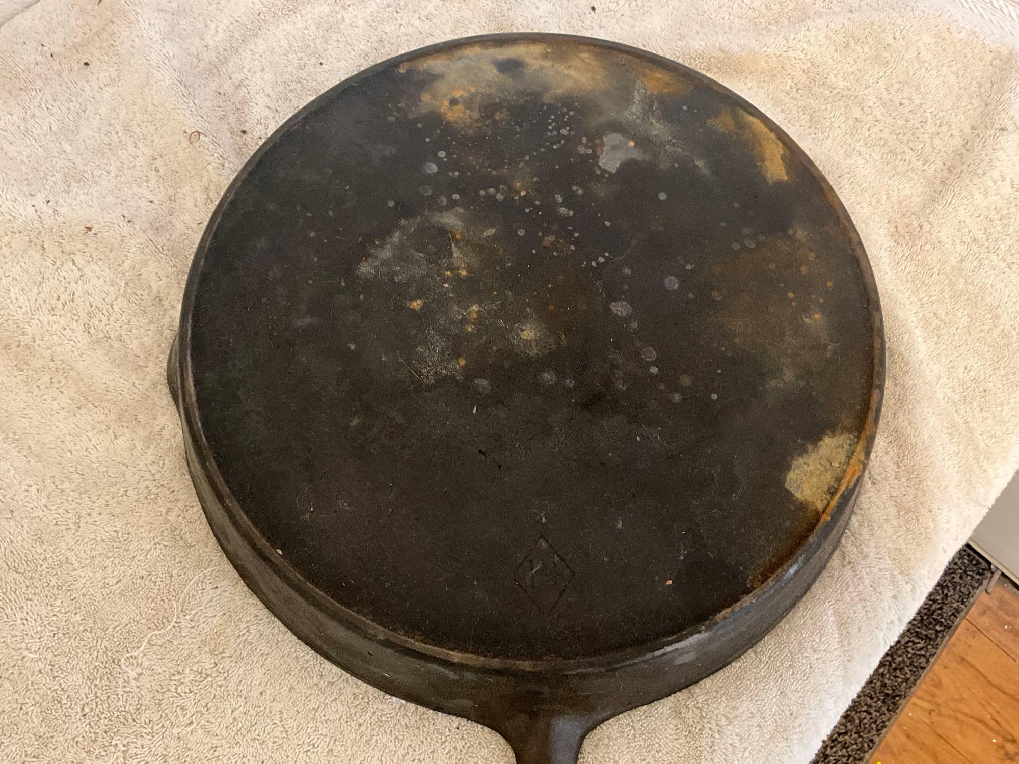 unmarked #10 cast iron skillet w/glass lid & unmarked #14 cast iron skillet