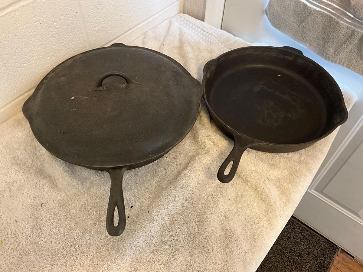 (2) unmarked USA cast iron skillets