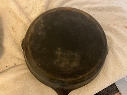 (2) unmarked USA cast iron skillets