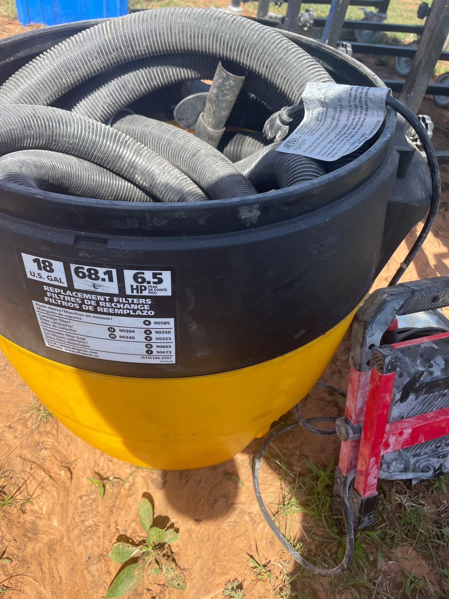 shop vac bottom container, hoses, and utility light