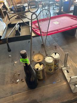 vintage cans and Angel candle holder and beer bottle