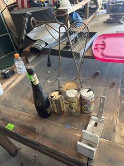 vintage cans and Angel candle holder and beer bottle