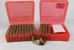 Two red plastic ammo boxes of fired 41 Rem Mag brass. Count 144.