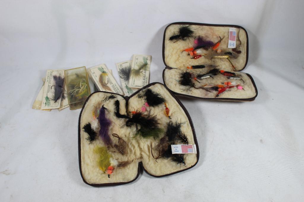 Nylon bag with two leather fly carriers with flies and numerous fly fishing flies in packages.