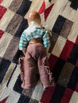 Porcelain cowboy doll