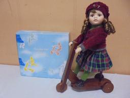 Beautiful Porcelain Doll on Wooden Scooter