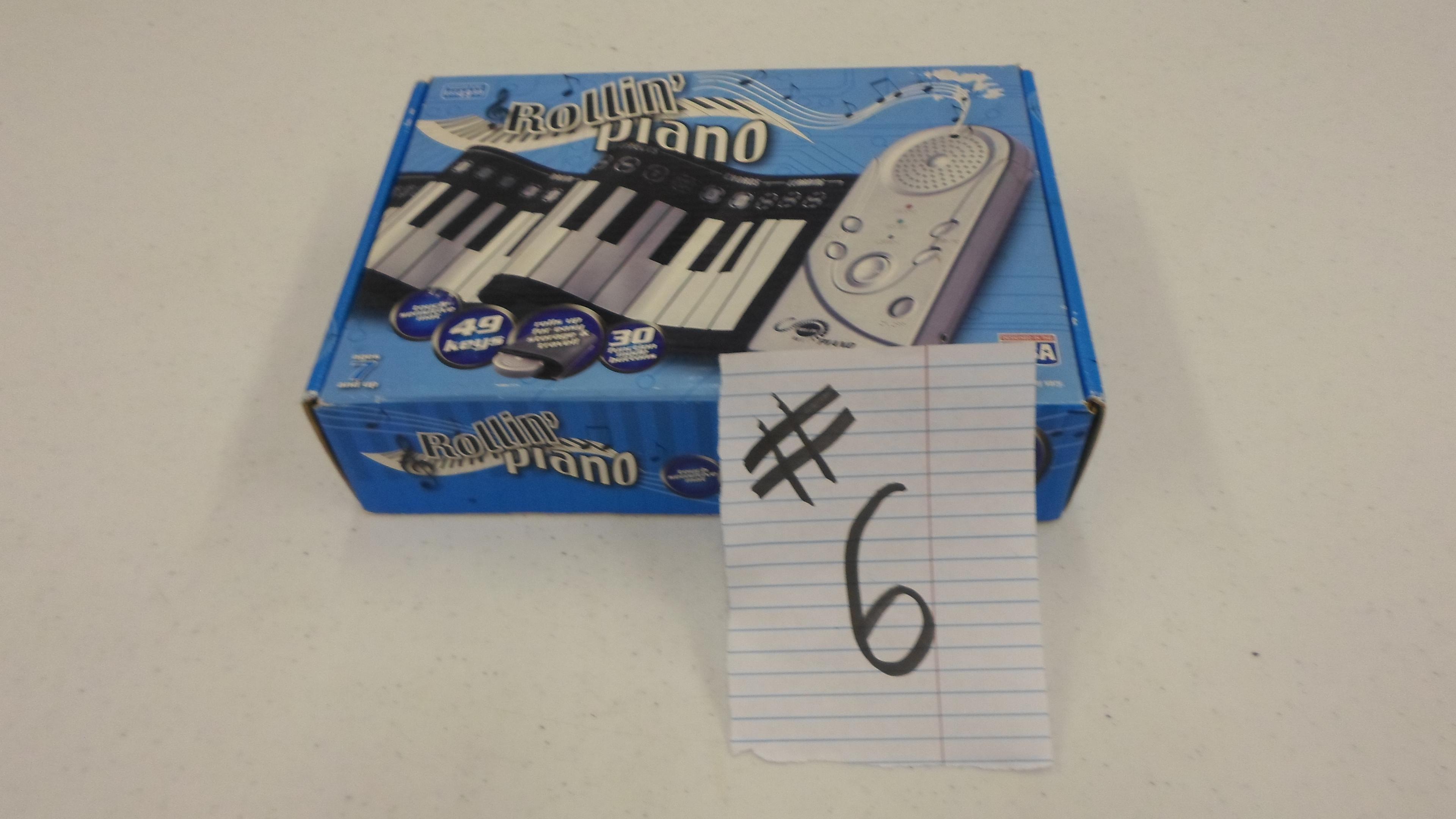 keyboard, rolled piano in box new sold for 50 dollars