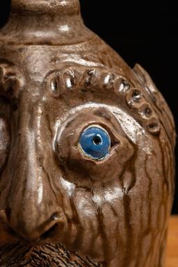 Brown Glazeware Face Jug with Blue Eyes by Mike Craven