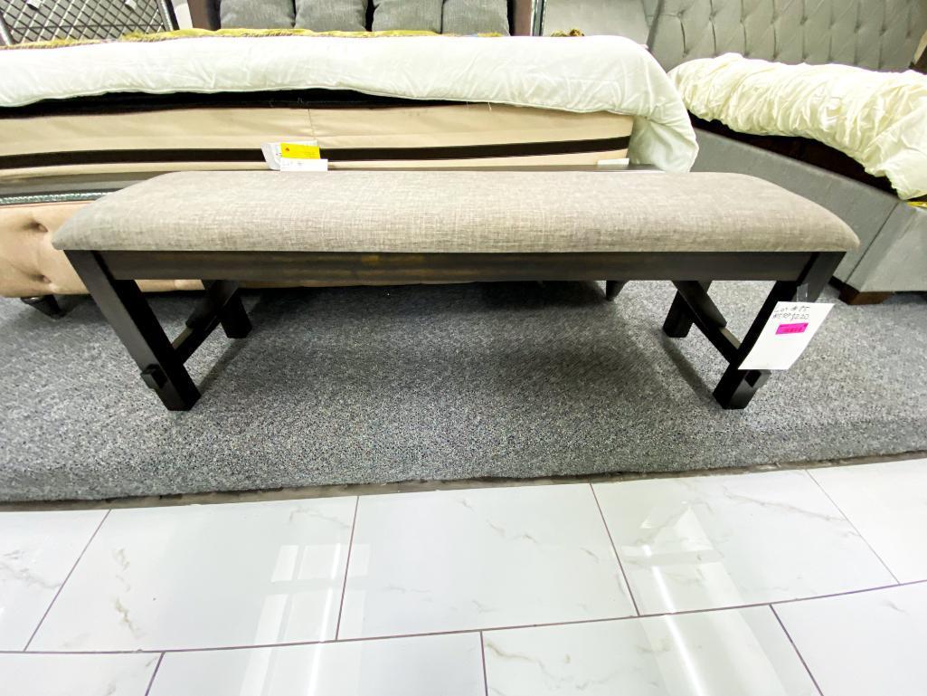 Grey cushioned bench