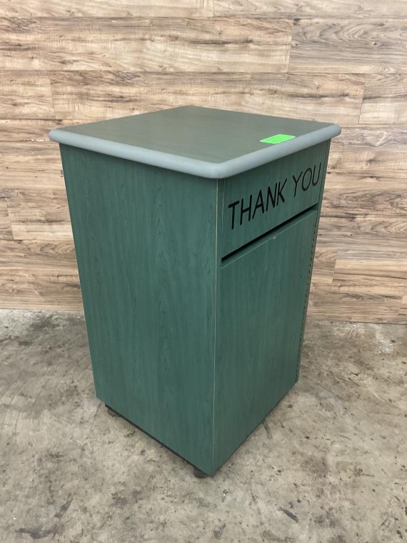 Green Trash receptacle.