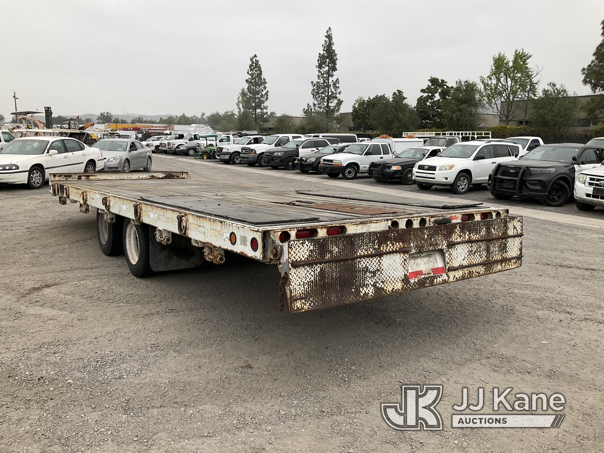 (Jurupa Valley, CA) 2003 Monroe Towmaster T/A Tagalong Flatbed Trailer Trailer Length: 24ft 8in, Tra