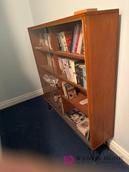 basement glass door bookshelf with books