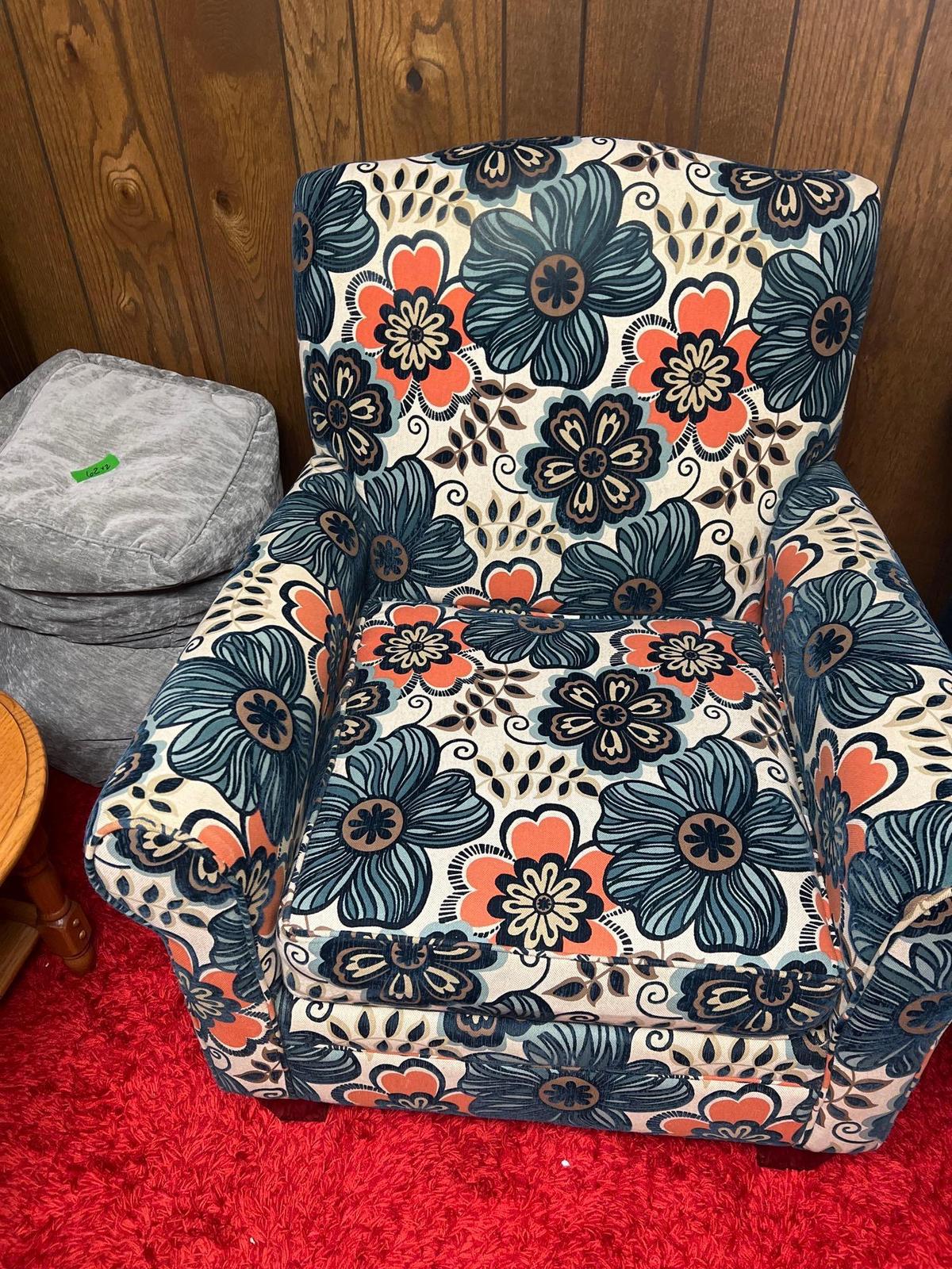 flowered print chair in basement