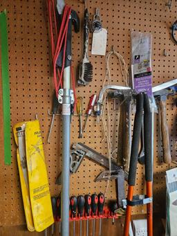 Assorted yard and hand tools.