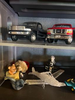 3 shelves of knickknacks cars, planes, Smurfs