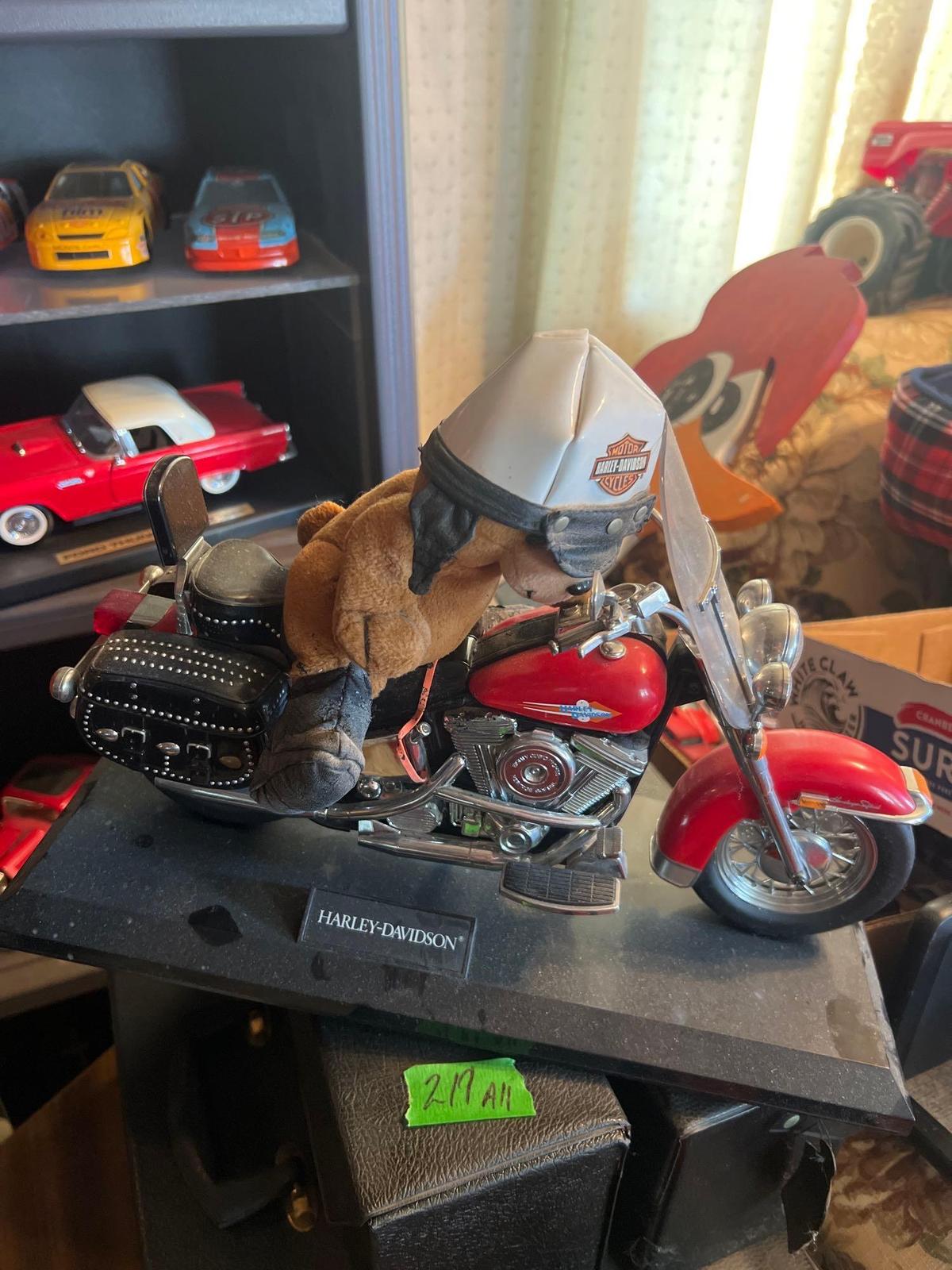 2 collector motorcycles, one Harley one wooden