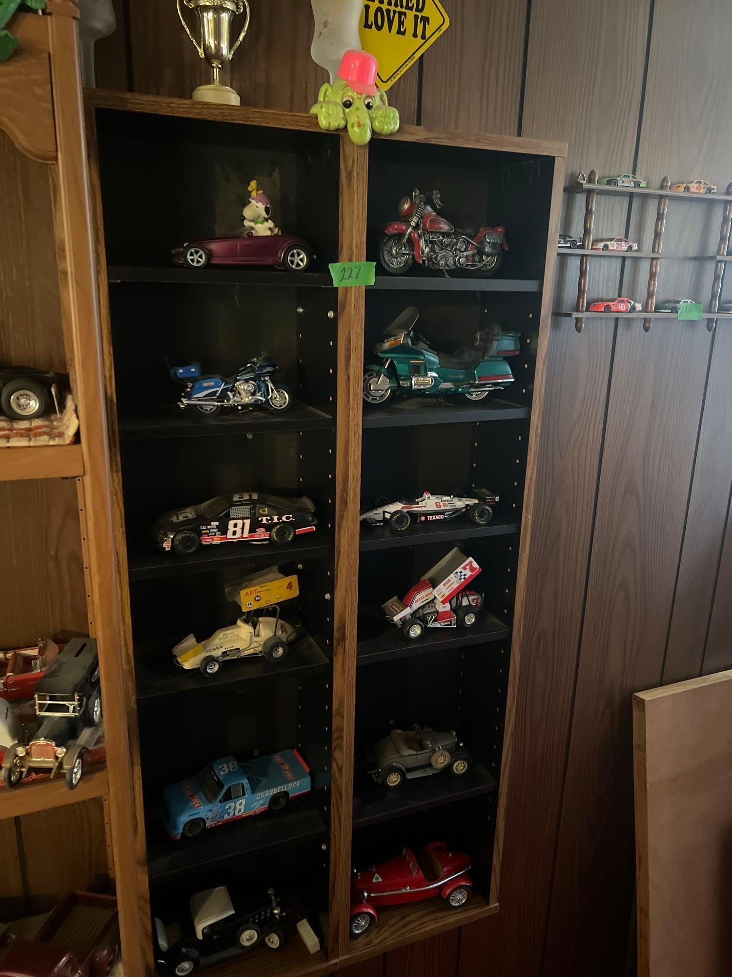 Shelf with collectors cars and motorcycles