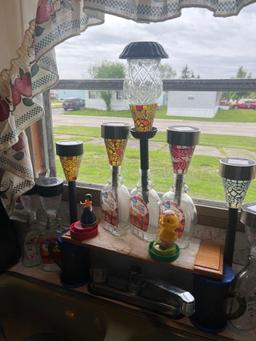 color solar lights and clock in kitchen