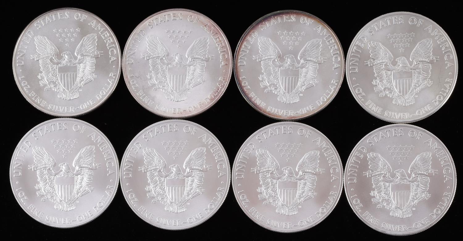 LOT OF 8 1 OZ AMERICAN SILVER EAGLE $1 COINS