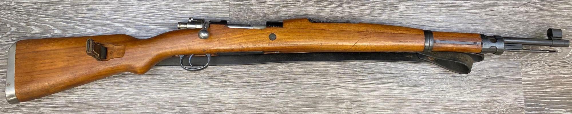 MAUSER MODEL M48A 8MM MAUSER CALIBER BOLT-ACTION RIFLE WITH LEATHER SLING.