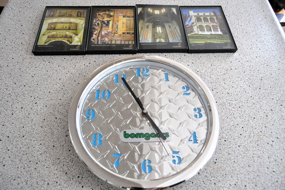Advertising wall clock and small pictures