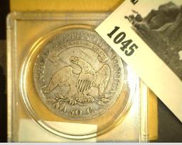 1808 Capped Bust Half Dollar in a Snaptight Case. Scratches on reverse.