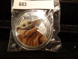 Baby Yoda "The Child" Star Wars Tribute Coin in capsule.